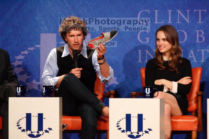 Blake Mycoskie (L), founder of TOMS shoes, holds up a pair of TOMS, with Natalie Portman (R) at the first plenary session of the CGIU meeting. Day one of the 2nd Annual Clinton Global Initiative University (CGIU) meeting was held at The University of Texas at Austin, Friday, February 13, 2009.
Filename: SRM_20090213_17150501.jpg
Aperture: f/5.6
Shutter Speed: 1/200
Body: Canon EOS-1D Mark II
Lens: Canon EF 300mm f/2.8 L IS