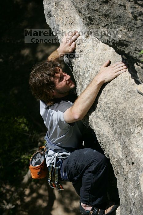 Andrew Dreher leading Lick the Window (5.10c), shot from the top of Ack! (5.11b, but using the crack for the start instead) that I top roped up with my camera on my back.  It was another long day of rock climbing at Seismic Wall on Austin's Barton Creek Greenbelt, Sunday, April 5, 2009.

Filename: SRM_20090405_13225799.jpg
Aperture: f/7.1
Shutter Speed: 1/500
Body: Canon EOS-1D Mark II
Lens: Canon EF 80-200mm f/2.8 L