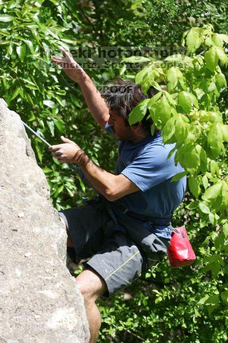 Javier Morales leading Nose Print on the Windshield (5.11c), shot from the top of Ack! (5.11b, but using the crack for the start instead) that I top roped up with my camera on my back. It was another long day of rock climbing at Seismic Wall on Austin's Barton Creek Greenbelt, Sunday, April 5, 2009.
Filename: SRM_20090405_13342901.jpg
Aperture: f/7.1
Shutter Speed: 1/500
Body: Canon EOS-1D Mark II
Lens: Canon EF 80-200mm f/2.8 L