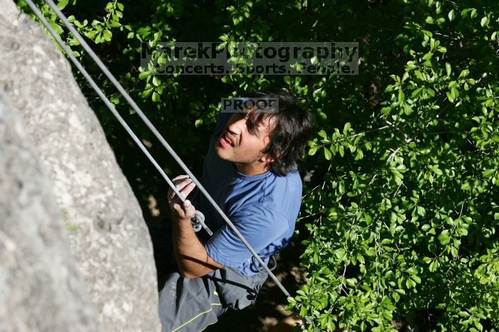 Javier Morales top rope climbing She's No Dog, She's My Wife (5.11b), shot from the top of Ack! (5.11b, but using the crack for the start instead) that I top roped up with my camera on my back.  It was another long day of rock climbing at Seismic Wall on Austin's Barton Creek Greenbelt, Sunday, April 5, 2009.

Filename: SRM_20090405_16093189.jpg
Aperture: f/10.0
Shutter Speed: 1/500
Body: Canon EOS-1D Mark II
Lens: Canon EF 80-200mm f/2.8 L