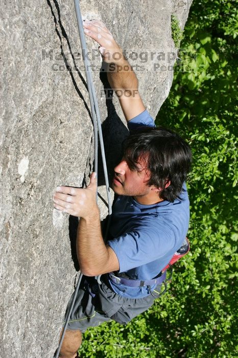 Javier Morales top rope climbing She's No Dog, She's My Wife (5.11b), shot from the top of Ack! (5.11b, but using the crack for the start instead) that I top roped up with my camera on my back.  It was another long day of rock climbing at Seismic Wall on Austin's Barton Creek Greenbelt, Sunday, April 5, 2009.

Filename: SRM_20090405_16173717.jpg
Aperture: f/10.0
Shutter Speed: 1/500
Body: Canon EOS-1D Mark II
Lens: Canon EF 80-200mm f/2.8 L