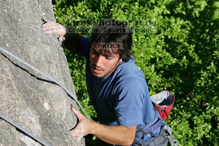 Javier Morales top rope climbing She's No Dog, She's My Wife (5.11b), shot from the top of Ack! (5.11b, but using the crack for the start instead) that I top roped up with my camera on my back.  It was another long day of rock climbing at Seismic Wall on Austin's Barton Creek Greenbelt, Sunday, April 5, 2009.

Filename: SRM_20090405_16482150.jpg
Aperture: f/8.0
Shutter Speed: 1/500
Body: Canon EOS-1D Mark II
Lens: Canon EF 80-200mm f/2.8 L