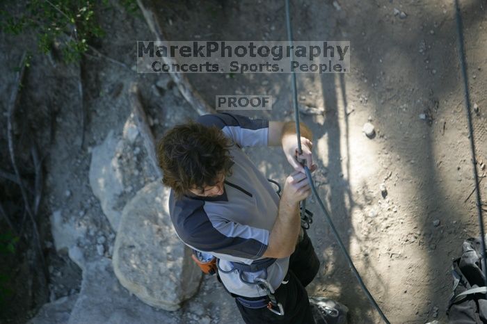 Andrew Dreher getting ready to belay me on top rope up Lick the Window (5.10c), shot by Javier Morales from the top of Ack! (5.11b, but using the crack for the start instead) that I top roped up with my camera on my back.  It was another long day of rock climbing at Seismic Wall on Austin's Barton Creek Greenbelt, Sunday, April 5, 2009.

Filename: SRM_20090405_17143181.jpg
Aperture: f/2.8
Shutter Speed: 1/400
Body: Canon EOS-1D Mark II
Lens: Canon EF 80-200mm f/2.8 L