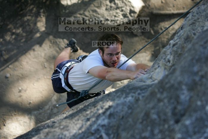 Me top roping Lick the Window (5.10c), shot by Javier Morales from the top of Ack! (5.11b, but using the crack for the start instead) that I top roped up with my camera on my back.  It was another long day of rock climbing at Seismic Wall on Austin's Barton Creek Greenbelt, Sunday, April 5, 2009.

Filename: SRM_20090405_17181607.jpg
Aperture: f/3.2
Shutter Speed: 1/400
Body: Canon EOS-1D Mark II
Lens: Canon EF 80-200mm f/2.8 L