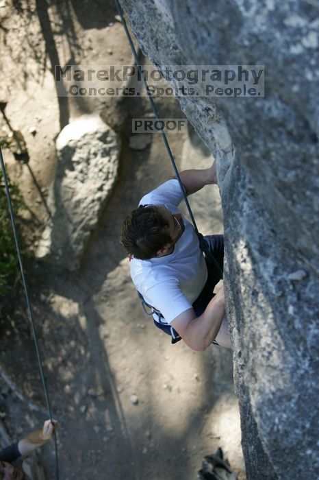 Me top roping Lick the Window (5.10c), shot by Javier Morales from the top of Ack! (5.11b, but using the crack for the start instead) that I top roped up with my camera on my back.  It was another long day of rock climbing at Seismic Wall on Austin's Barton Creek Greenbelt, Sunday, April 5, 2009.

Filename: SRM_20090405_17184939.jpg
Aperture: f/3.2
Shutter Speed: 1/400
Body: Canon EOS-1D Mark II
Lens: Canon EF 80-200mm f/2.8 L