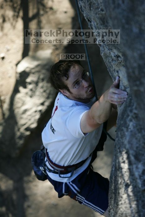 Me top roping Lick the Window (5.10c), shot by Javier Morales from the top of Ack! (5.11b, but using the crack for the start instead) that I top roped up with my camera on my back.  It was another long day of rock climbing at Seismic Wall on Austin's Barton Creek Greenbelt, Sunday, April 5, 2009.

Filename: SRM_20090405_17202276.jpg
Aperture: f/4.0
Shutter Speed: 1/400
Body: Canon EOS-1D Mark II
Lens: Canon EF 80-200mm f/2.8 L