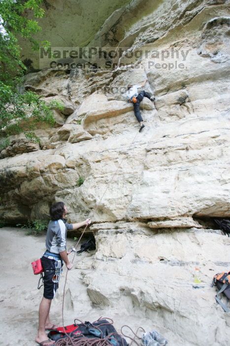 Andrew Dreher lead climbing Magster (5.10a) with Javier Morales belaying.  It was another long day of rock climbing at Seismic Wall on Austin's Barton Creek Greenbelt, Saturday, April 11, 2009.

Filename: SRM_20090411_15315084.JPG
Aperture: f/3.5
Shutter Speed: 1/250
Body: Canon EOS-1D Mark II
Lens: Canon EF 16-35mm f/2.8 L