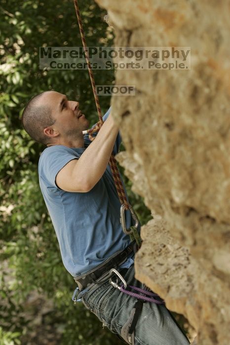 Sean O'Grady climbs in just running shoes.  CTM hosted a speed climbing event at Seismic Wall on Diving for Rocks to benefit the Austin Area Food Bank, Saturday, May 9, 2009.

Filename: SRM_20090509_11315504.jpg
Aperture: f/5.6
Shutter Speed: 1/500
Body: Canon EOS-1D Mark II
Lens: Canon EF 80-200mm f/2.8 L
