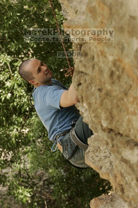 Sean O'Grady climbs in just running shoes.  CTM hosted a speed climbing event at Seismic Wall on Diving for Rocks to benefit the Austin Area Food Bank, Saturday, May 9, 2009.

Filename: SRM_20090509_11315710.jpg
Aperture: f/5.6
Shutter Speed: 1/500
Body: Canon EOS-1D Mark II
Lens: Canon EF 80-200mm f/2.8 L