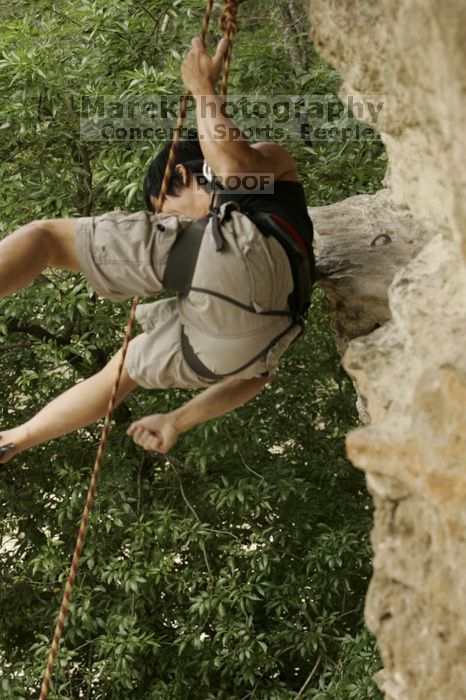 Long Ta, winner of the speed competition with a time of 15.33 seconds.  CTM hosted a speed climbing event at Seismic Wall on Diving for Rocks to benefit the Austin Area Food Bank, Saturday, May 9, 2009.

Filename: SRM_20090509_11333862.jpg
Aperture: f/5.6
Shutter Speed: 1/320
Body: Canon EOS-1D Mark II
Lens: Canon EF 80-200mm f/2.8 L