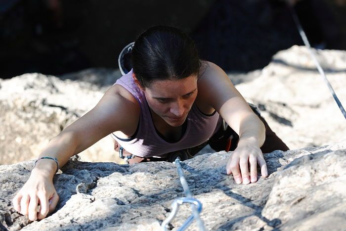 Beth Marek top rope climbing Roo Dog (5.8), taken from the anchors of the route. It was Beth's third time outside, and another long day of rock climbing at Seismic Wall on Austin's Barton Creek Greenbelt, Monday, May 25, 2009.
Filename: SRM_20090525_09503368.JPG
Aperture: f/5.6
Shutter Speed: 1/500
Body: Canon EOS-1D Mark II
Lens: Canon EF 80-200mm f/2.8 L