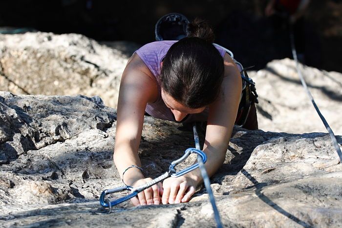 Beth Marek top rope climbing Roo Dog (5.8), taken from the anchors of the route. It was Beth's third time outside, and another long day of rock climbing at Seismic Wall on Austin's Barton Creek Greenbelt, Monday, May 25, 2009.
Filename: SRM_20090525_09510583.JPG
Aperture: f/5.6
Shutter Speed: 1/640
Body: Canon EOS-1D Mark II
Lens: Canon EF 80-200mm f/2.8 L