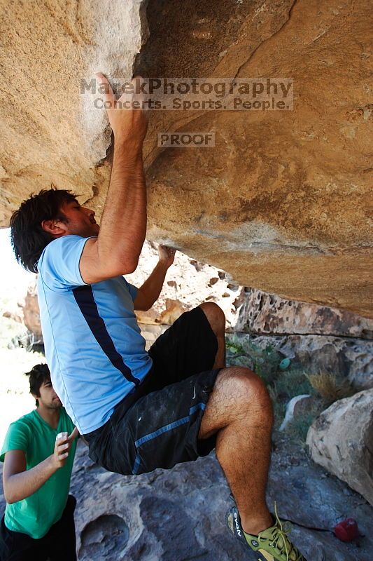 Javier Morales rock climbing on Mexican Chicken (V6) in Hueco Tanks State Park and Historic Site during the Hueco Tanks Awesome Fest 2010 trip, Monday, May 24, 2010.

Filename: SRM_20100524_11550696.JPG
Aperture: f/4.0
Shutter Speed: 1/640
Body: Canon EOS-1D Mark II
Lens: Canon EF 16-35mm f/2.8 L