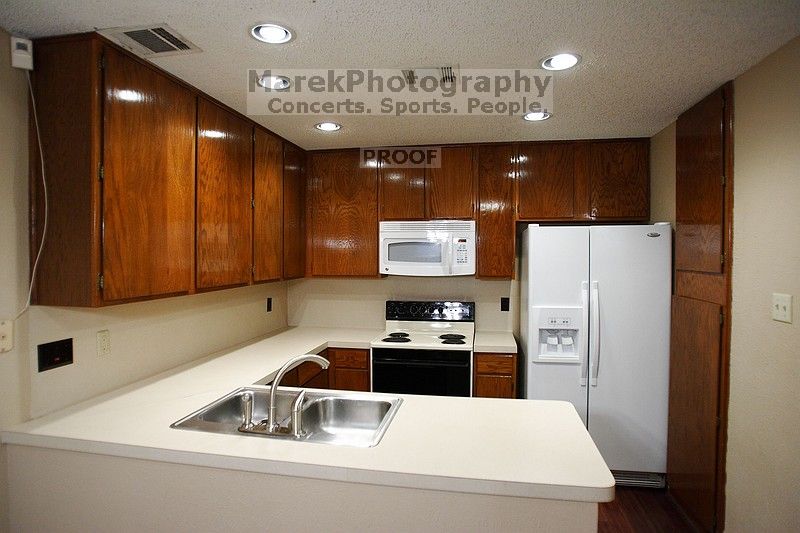 View of the kitchen. Microwave, refrigerator and dishwasher have been recently upgraded.

Filename: SRM_20101228_17422238.JPG
Aperture: f/2.8
Shutter Speed: 1/80
Body: Canon EOS-1D Mark II
Lens: Canon EF 16-35mm f/2.8 L