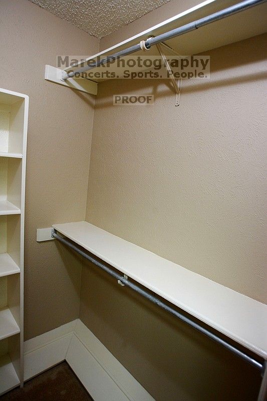 View of the master walk-in closet from the bathroom.

Filename: SRM_20101228_17504452.JPG
Aperture: f/2.8
Shutter Speed: 1/50
Body: Canon EOS-1D Mark II
Lens: Canon EF 16-35mm f/2.8 L