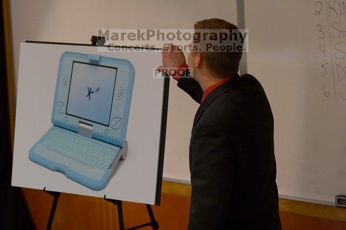 Drew Farmer practicing his informative speech on bridging the digital gap with the $100 computer.  The University of Texas' Speech Team will compete in the American Forensic Association’s National Individual Events Tournament (AFA NIET) in Gainesville, Florida, March 30 through April 4.

Filename: SRM_20060325_124522_3.jpg
Aperture: f/3.2
Shutter Speed: 1/100
Body: Canon EOS 20D
Lens: Canon EF 80-200mm f/2.8 L