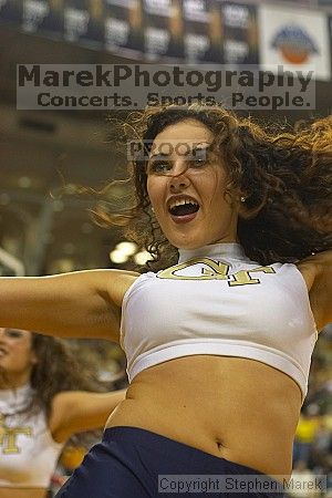 Random Tech Dance Team member.  Men's Basketball Georgia Tech beat UGA 87-49.

Filename: crw_5993_std.jpg
Aperture: f/2.8
Shutter Speed: 1/160
Body: Canon EOS DIGITAL REBEL
Lens: Canon EF 50mm f/1.8 II