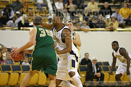 Mario West plays defense on LeMoyne at the men's basketball game.                                                                                                                                                                                              

Filename: img_4085_std.jpg
Aperture: f/2.8
Shutter Speed: 1/500
Body: Canon EOS DIGITAL REBEL
Lens: Canon EF 80-200mm f/2.8 L