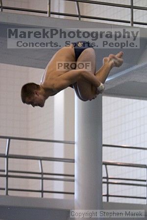 Diver Pete Doblar competes against the University of Tennessee.

Filename: crw_2271_std.jpg
Aperture: f/2.8
Shutter Speed: 1/500
Body: Canon EOS DIGITAL REBEL
Lens: Canon EF 80-200mm f/2.8 L
