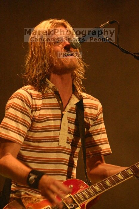 Puddle of Mudd performs on the first day of Music Midtown, 2004.

Filename: IMG_6048.jpg
Aperture: f/3.5
Shutter Speed: 1/160
Body: Canon EOS DIGITAL REBEL
Lens: Canon EF 80-200mm f/2.8 L