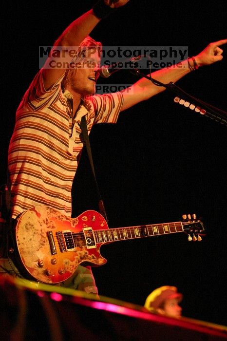 Puddle of Mudd performs on the first day of Music Midtown, 2004.

Filename: IMG_6062.jpg
Aperture: f/2.8
Shutter Speed: 1/160
Body: Canon EOS DIGITAL REBEL
Lens: Canon EF 80-200mm f/2.8 L
