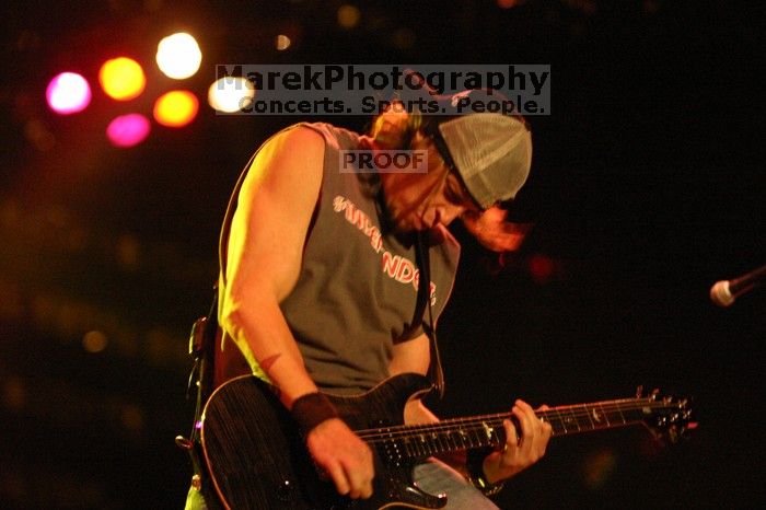 Puddle of Mudd performs on the first day of Music Midtown, 2004.

Filename: IMG_6069.jpg
Aperture: f/2.8
Shutter Speed: 1/160
Body: Canon EOS DIGITAL REBEL
Lens: Canon EF 80-200mm f/2.8 L
