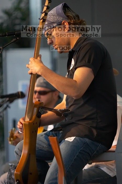 The Gene Pool, performing at the Austin airport.  Geno Stroia II on vocals/guitar, Jorge Castillo on vocals/guitar, Travis Woodard on drums and Steven Ray Will on vocals/bass guitar.

Filename: SRM_20060518_154746_6.jpg
Aperture: f/2.8
Shutter Speed: 1/200
Body: Canon EOS 20D
Lens: Canon EF 80-200mm f/2.8 L