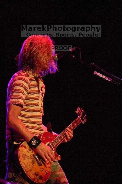 Puddle of Mudd performs on the 99X stage on the first day of Music Midtown, 2004.

Filename: IMG_6093.jpg
Aperture: f/2.8
Shutter Speed: 1/160
Body: Canon EOS DIGITAL REBEL
Lens: Canon EF 80-200mm f/2.8 L