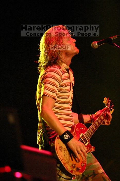 Puddle of Mudd performs on the 99X stage on the first day of Music Midtown, 2004.
Filename: IMG_6086.jpg
Aperture: f/2.8
Shutter Speed: 1/160
Body: Canon EOS DIGITAL REBEL
Lens: Canon EF 80-200mm f/2.8 L