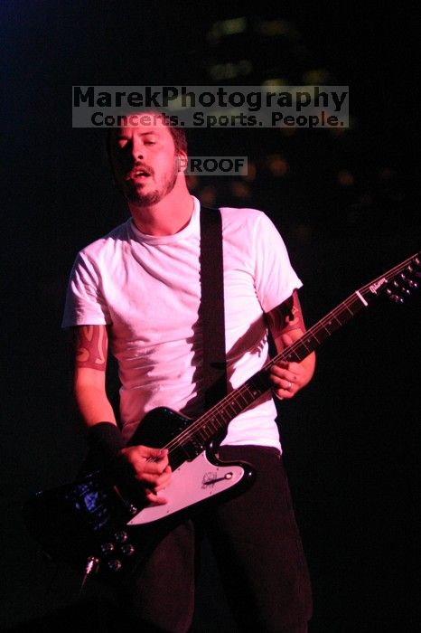 The Foo Fighters perform on the 99X stage on the second day of Music Midtown, 2004.

Filename: IMG_6811.jpg
Aperture: f/2.8
Shutter Speed: 1/200
Body: Canon EOS DIGITAL REBEL
Lens: Canon EF 80-200mm f/2.8 L