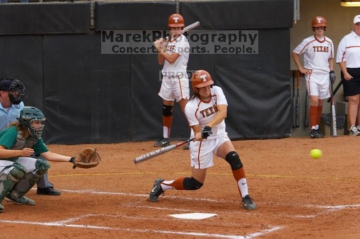 #44, Desiree Williams, hit a home run against the Mean Green.  The Lady Longhorns beat the University of North Texas 5-0 in the first game of the double header Wednesday night.

Filename: SRM_20060308_205125_6.jpg
Aperture: f/4.5
Shutter Speed: 1/500
Body: Canon EOS 20D
Lens: Canon EF 80-200mm f/2.8 L