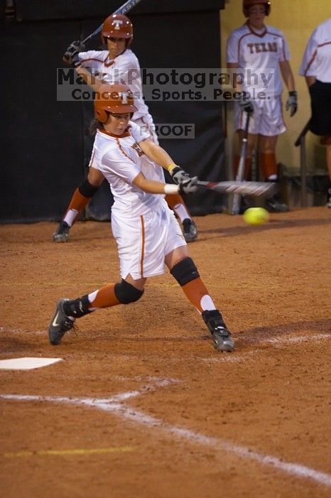 #12, Kelly Melone, bats against the Mean Green.  The Lady Longhorns beat the University of North Texas 5-0 in the first game of the double header Wednesday night.

Filename: SRM_20060308_213127_0.jpg
Aperture: f/2.8
Shutter Speed: 1/400
Body: Canon EOS 20D
Lens: Canon EF 80-200mm f/2.8 L
