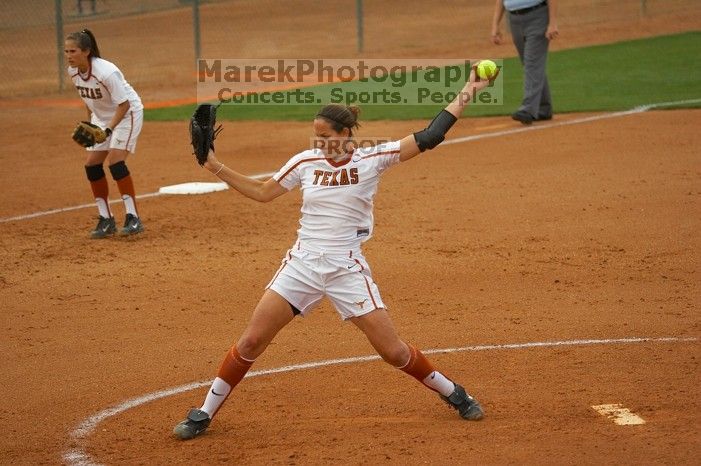 Cat Osterman pitching to the Mean Green.  The Lady Longhorns beat the University of North Texas 5-0 in the first game of the double header Wednesday night.

Filename: SRM_20060308_204338_4.jpg
Aperture: f/2.8
Shutter Speed: 1/2500
Body: Canon EOS 20D
Lens: Canon EF 80-200mm f/2.8 L