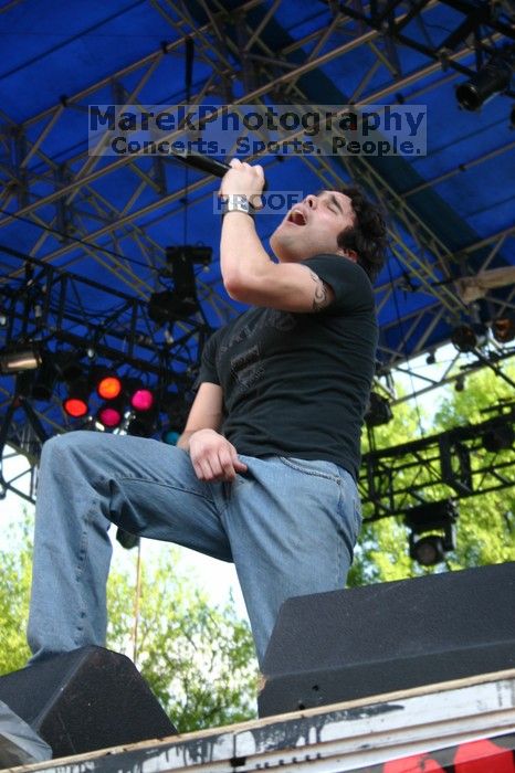 Trapt performs on the 99X stage on the second day of Music Midtown, 2004.
Filename: IMG_6505.jpg
Aperture: f/5.6
Shutter Speed: 1/125
Body: Canon EOS DIGITAL REBEL
Lens: Canon EF-S 18-55mm f/3.5-5.6