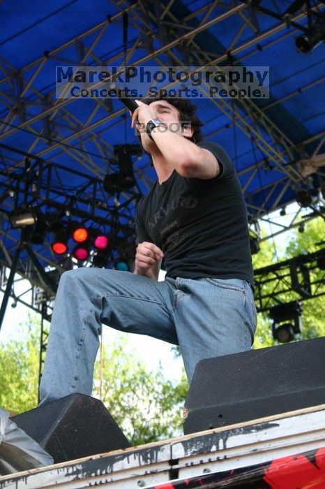 Trapt performs on the 99X stage on the second day of Music Midtown, 2004.
Filename: IMG_6506.jpg
Aperture: f/5.6
Shutter Speed: 1/125
Body: Canon EOS DIGITAL REBEL
Lens: Canon EF-S 18-55mm f/3.5-5.6