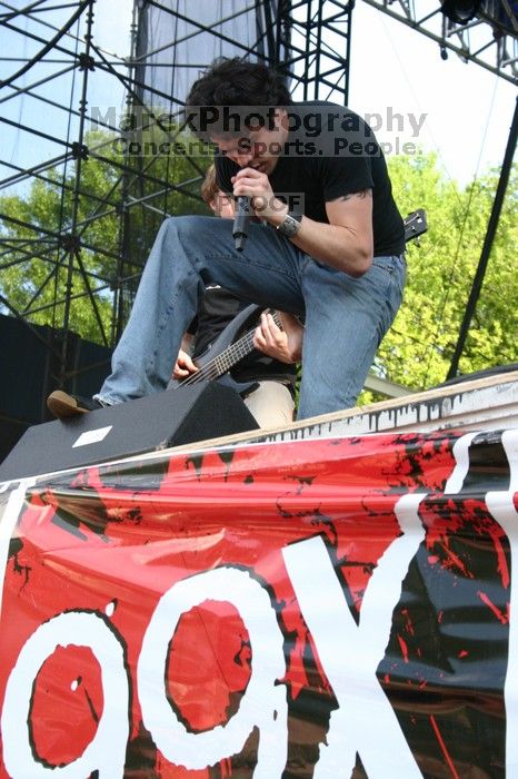 Trapt performs on the 99X stage on the second day of Music Midtown, 2004.
Filename: IMG_6517.jpg
Aperture: f/9.0
Shutter Speed: 1/125
Body: Canon EOS DIGITAL REBEL
Lens: Canon EF-S 18-55mm f/3.5-5.6