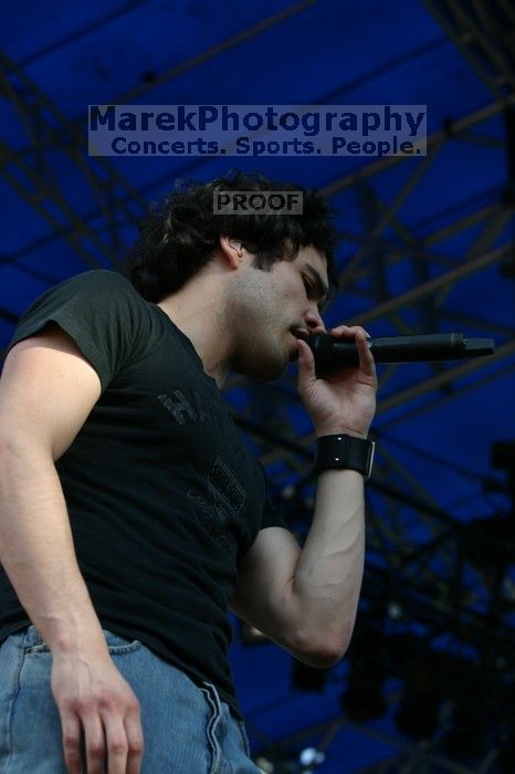Trapt performs on the 99X stage on the second day of Music Midtown, 2004.
Filename: IMG_6478.jpg
Aperture: f/5.0
Shutter Speed: 1/320
Body: Canon EOS DIGITAL REBEL
Lens: Canon EF 80-200mm f/2.8 L