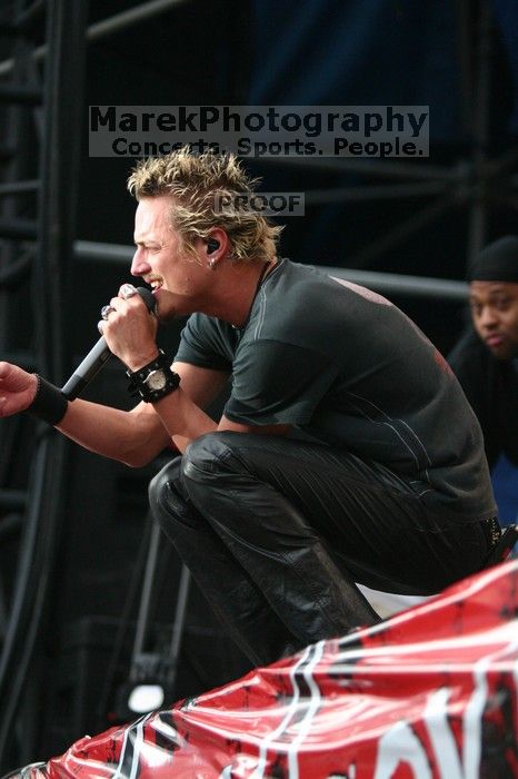 Fuel performs on the 99X stage on the third day of Music Midtown, 2004.

Filename: IMG_7199.jpg
Aperture: f/2.8
Shutter Speed: 1/320
Body: Canon EOS DIGITAL REBEL
Lens: Canon EF 80-200mm f/2.8 L