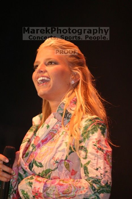 Jessica Simpson performs on the third day of Music Midtown, 2004.

Filename: IMG_7263.jpg
Aperture: f/2.8
Shutter Speed: 1/250
Body: Canon EOS DIGITAL REBEL
Lens: Canon EF 80-200mm f/2.8 L