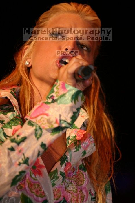 Jessica Simpson performs on the third day of Music Midtown, 2004.

Filename: IMG_7257.jpg
Aperture: f/2.8
Shutter Speed: 1/250
Body: Canon EOS DIGITAL REBEL
Lens: Canon EF 80-200mm f/2.8 L