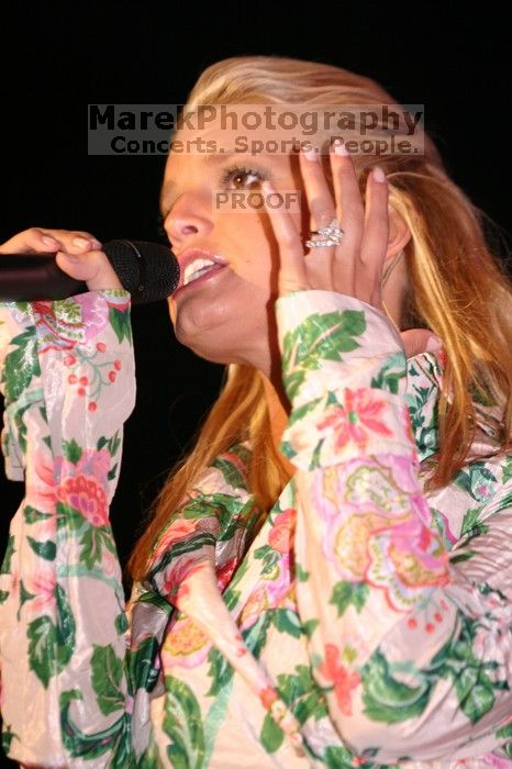 Jessica Simpson performs on the third day of Music Midtown, 2004.

Filename: IMG_7288.jpg
Aperture: f/2.8
Shutter Speed: 1/250
Body: Canon EOS DIGITAL REBEL
Lens: Canon EF 80-200mm f/2.8 L