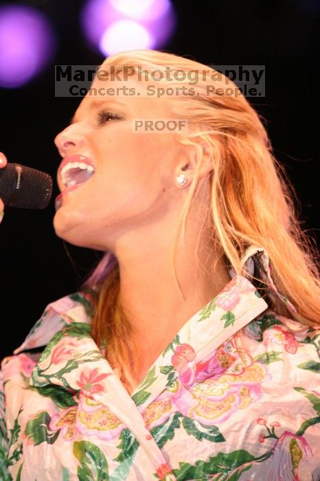 Jessica Simpson performs on the third day of Music Midtown, 2004.

Filename: IMG_7306.jpg
Aperture: f/2.8
Shutter Speed: 1/250
Body: Canon EOS DIGITAL REBEL
Lens: Canon EF 80-200mm f/2.8 L