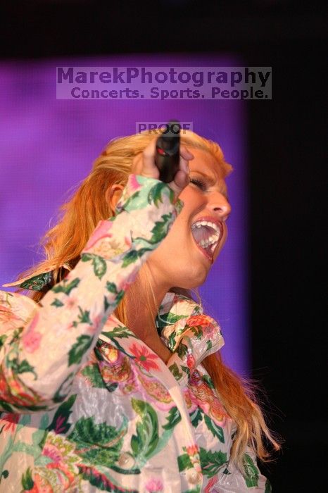 Jessica Simpson performs on the third day of Music Midtown, 2004.

Filename: IMG_7259.jpg
Aperture: f/2.8
Shutter Speed: 1/250
Body: Canon EOS DIGITAL REBEL
Lens: Canon EF 80-200mm f/2.8 L