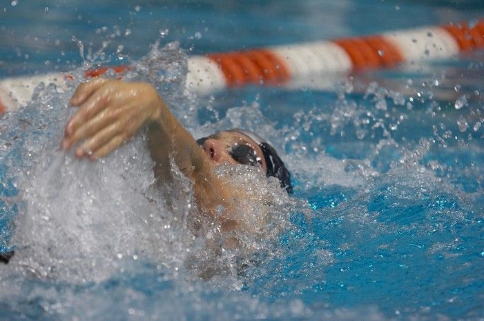 Garrett Weber Gale (Black Goggles) and Chris Seitz (Blue goggles) of the University of Texas Men's Varsity Swim Team placed 7th and 8th in the 6th heat of the 200 Backstroke Prelims with a time of 1:45.69 and 1:46.00 at the Speedo American Short Course Championships.

Filename: SRM_20060304_181418_9.jpg
Aperture: f/3.5
Shutter Speed: 1/640
Body: Canon EOS 20D
Lens: Canon EF 80-200mm f/2.8 L