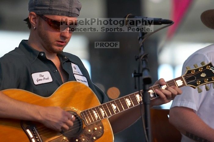 The Gene Pool, performing at the Austin airport.  Geno Stroia II on vocals/guitar, Jorge Castillo on vocals/guitar, Travis Woodard on drums and Steven Ray Will on vocals/bass guitar.

Filename: SRM_20060518_154950_3.jpg
Aperture: f/3.2
Shutter Speed: 1/200
Body: Canon EOS 20D
Lens: Canon EF 80-200mm f/2.8 L