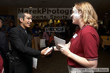 Amin Zargar speaks with a recruiter at the career fair.

Filename: crw_0770_std.jpg
Aperture: f/5.0
Shutter Speed: 1/60
Body: Canon EOS DIGITAL REBEL
Lens: Canon EF-S 18-55mm f/3.5-5.6