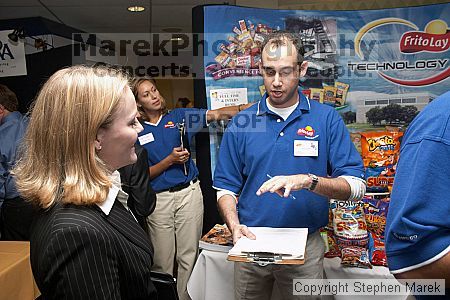 Robyn Smith speaks with a recruiter at the career fair.

Filename: crw_0775_std.jpg
Aperture: f/5.0
Shutter Speed: 1/60
Body: Canon EOS DIGITAL REBEL
Lens: Canon EF-S 18-55mm f/3.5-5.6