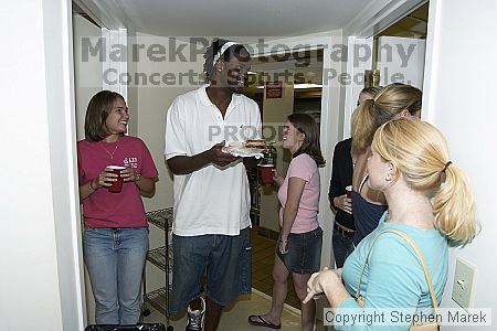 Clarence Moore talks to Kamber Christensen and Teresa Drew at AXO Thursday night.  AXO was the winning sorority for the basketball attendance competition.

Filename: crw_0070_std.jpg
Aperture: f/4.5
Shutter Speed: 1/60
Body: Canon EOS DIGITAL REBEL
Lens: Sigma 15-30mm f/3.5-4.5 EX Aspherical DG DF