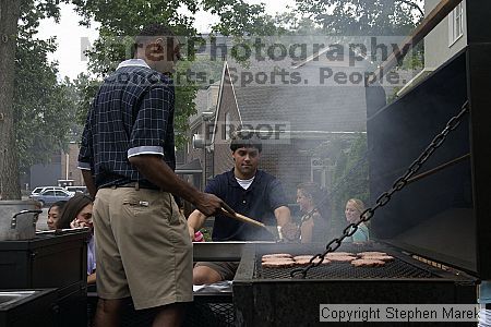 Coach Paul Hewitt and Jimmy Mitchell grill hamburgers at AXO Thursday night.  AXO was the winning sorority for the basketball attendance competition.

Filename: crw_0041_std.jpg
Aperture: f/5.6
Shutter Speed: 1/160
Body: Canon EOS DIGITAL REBEL
Lens: Sigma 15-30mm f/3.5-4.5 EX Aspherical DG DF